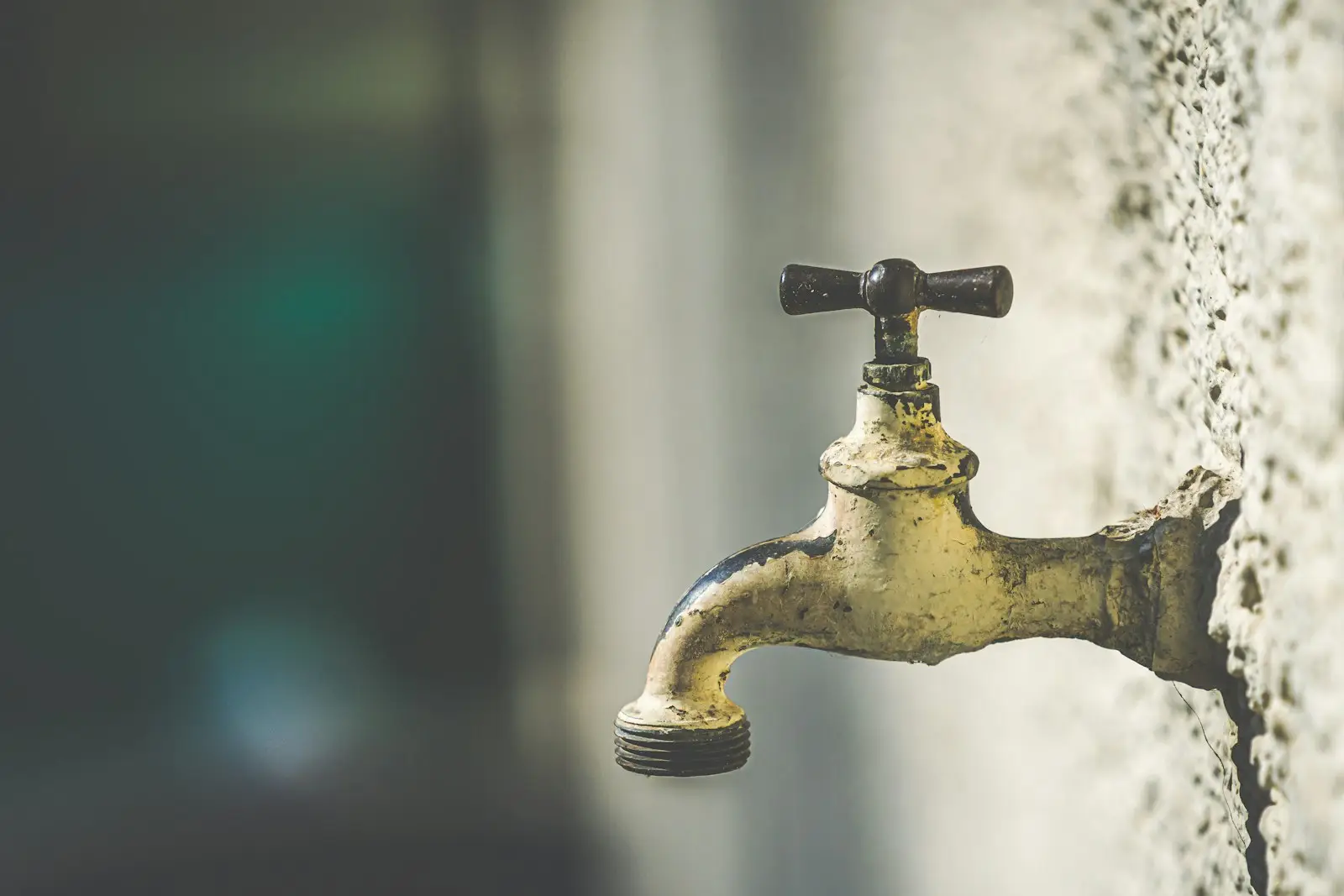 A brass water valve on a pipe